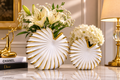 White ceramic seashell vase