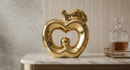 Glossy gold ceramic apple statue