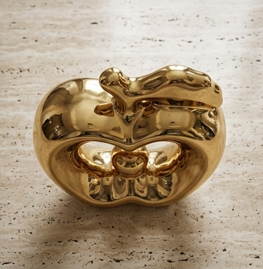Glossy gold ceramic apple statue