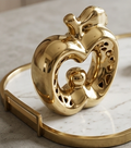 Glossy gold ceramic apple statue