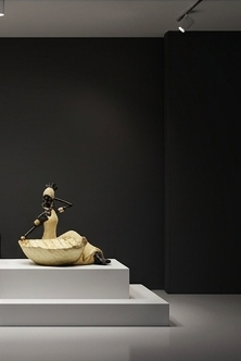 African woman statue with a storage tray