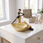 African woman statue with a storage tray