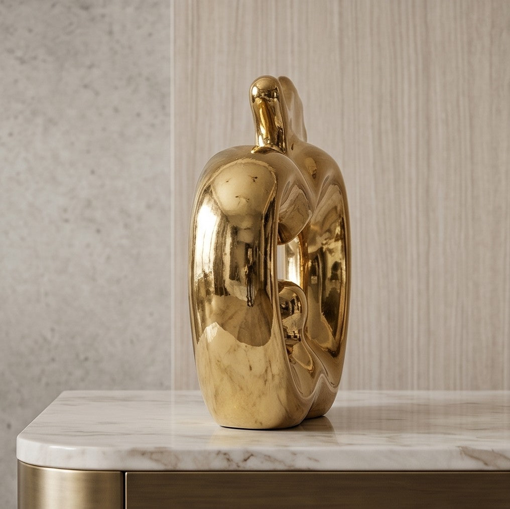 Glossy gold ceramic apple statue