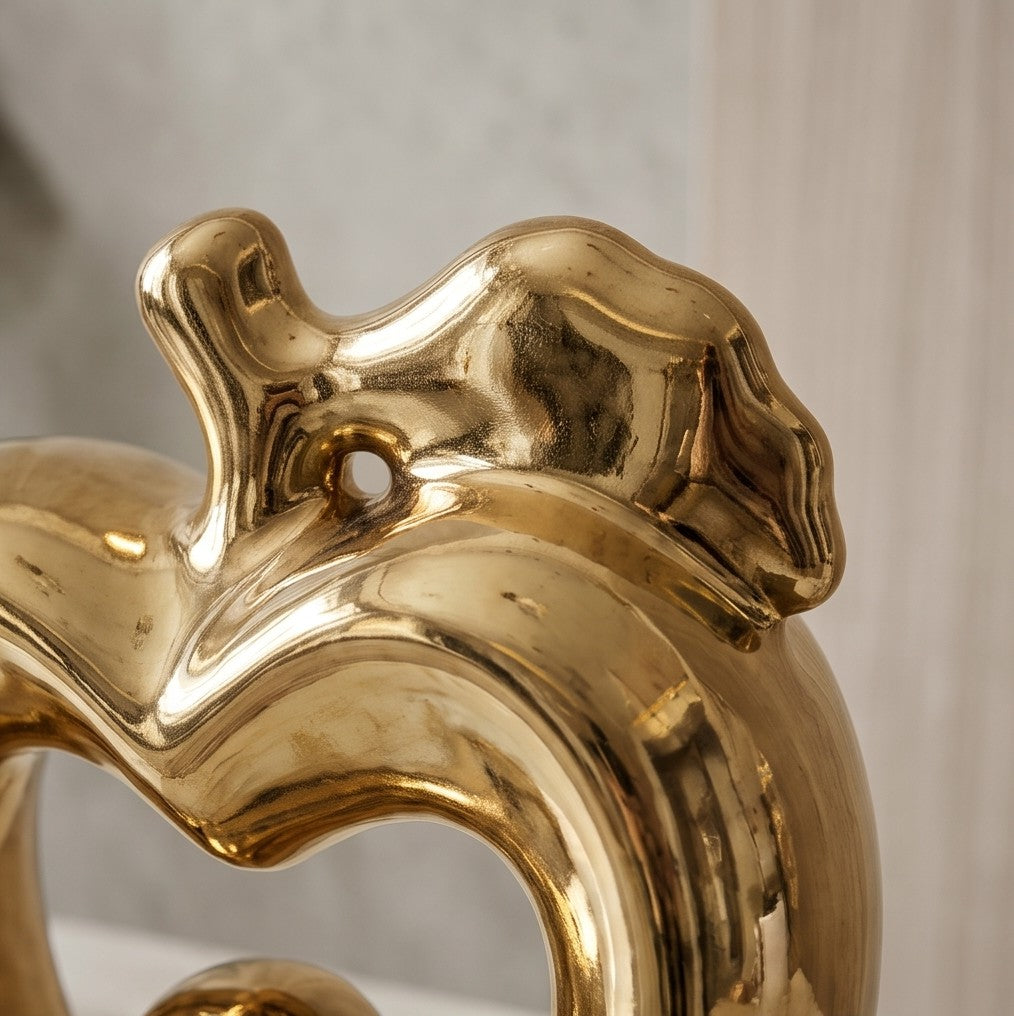Glossy gold ceramic apple statue