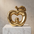 Glossy gold ceramic apple statue