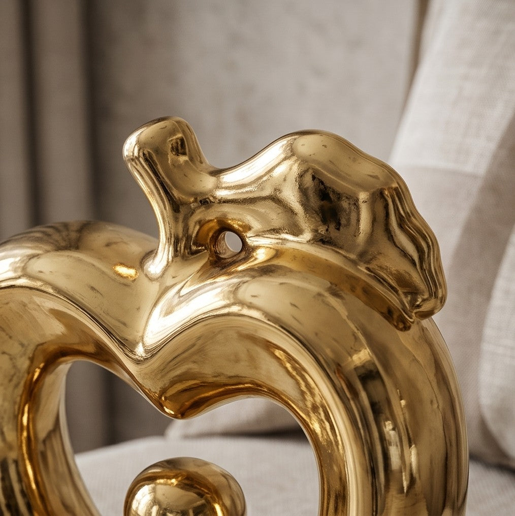 Glossy gold ceramic apple statue